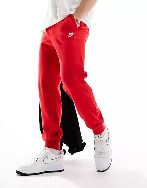 Nike Club logo knit sweatpants in red Cover