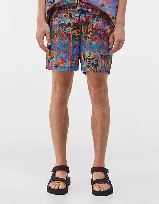 Bershka swim short with pattern print in orange Cover