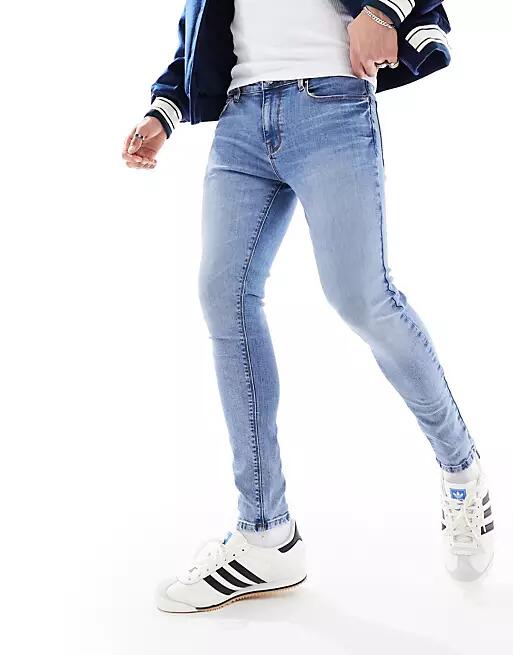 ASOS DESIGN spray on jeans with power-stretch in light blue wash Cover