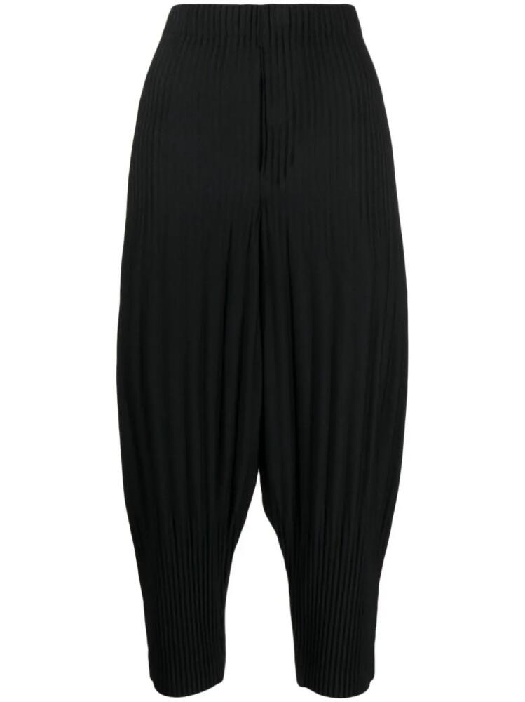 Homme Plissé Issey Miyake plissé cropped drop-crotch trousers - Black Cover