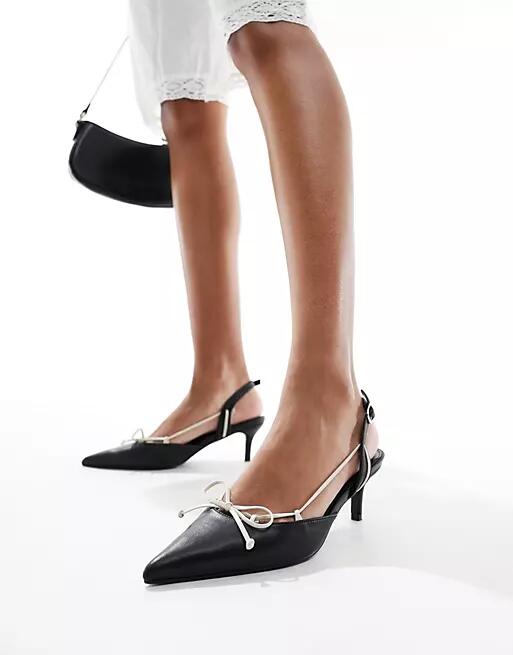 Public Desire Rai pointed heeled mule in black and cream Cover